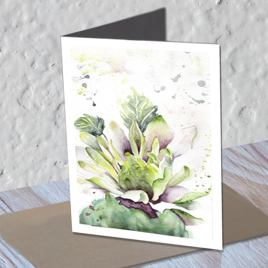 Dahlia watercolor greeting card standing on a kraft envelope.