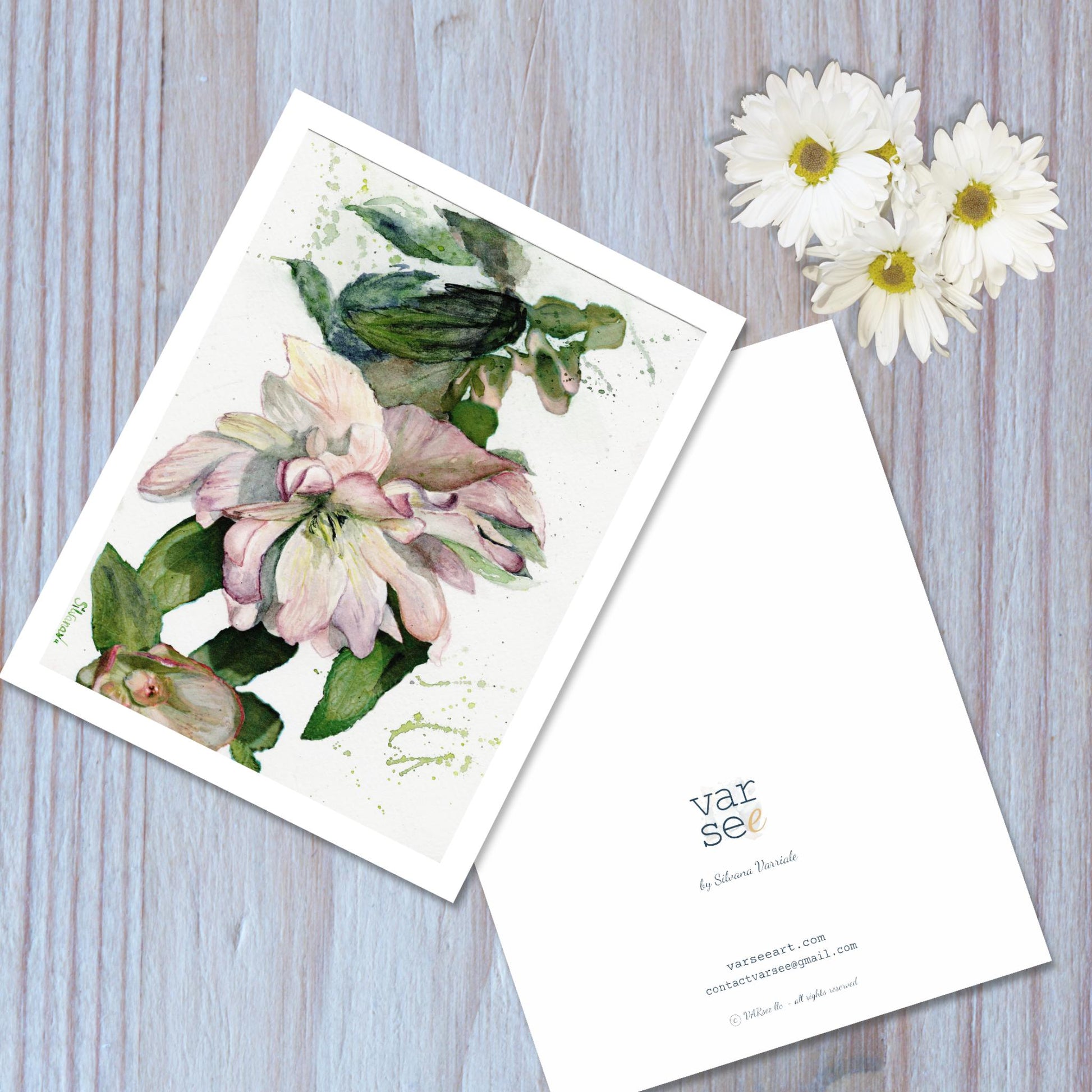 Front and back view of a hellebore watercolor art greeting card.