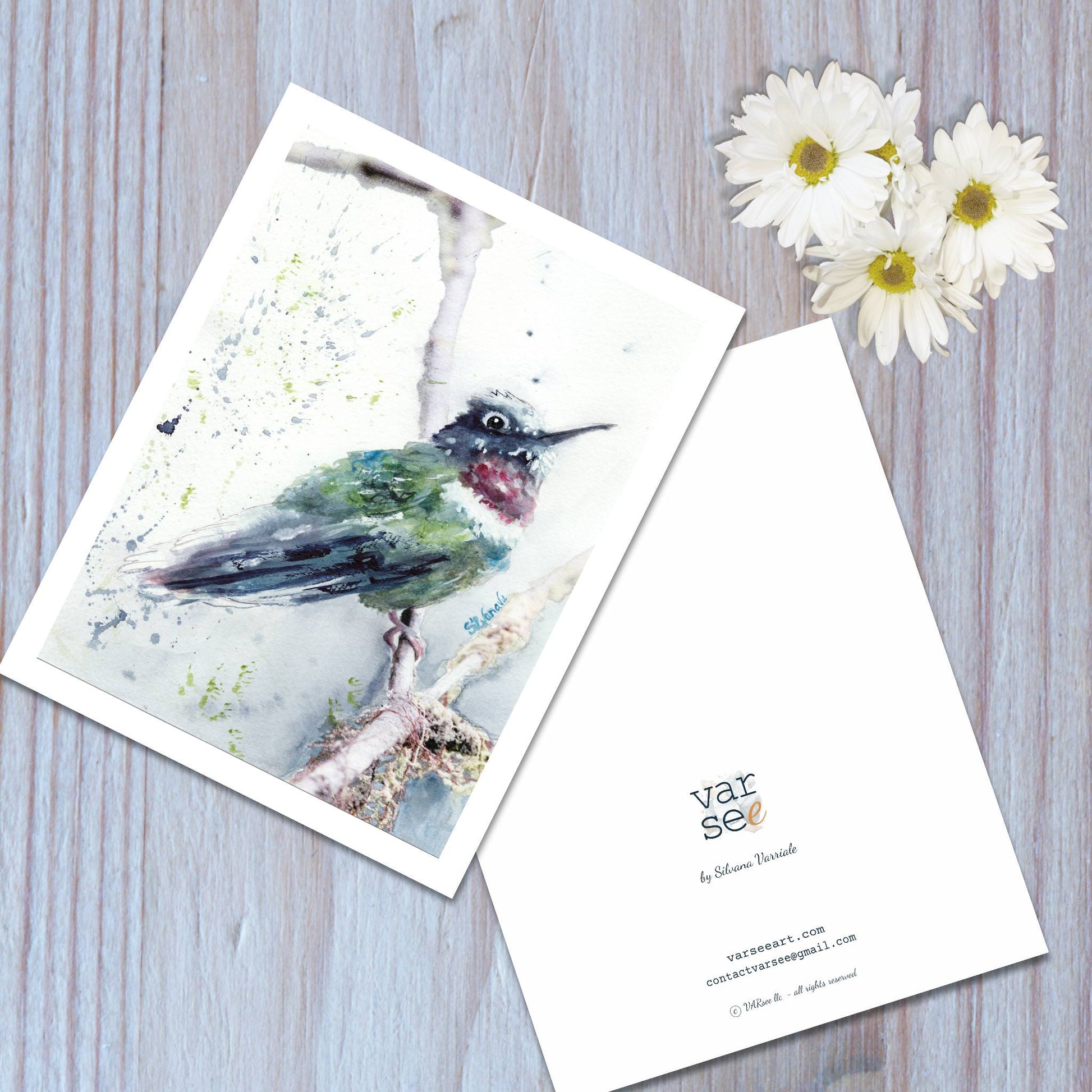 Front and back view of a hummingbird watercolor art greeting card.