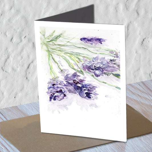 Lavender sprig watercolor greeting card standing on a kraft envelope.