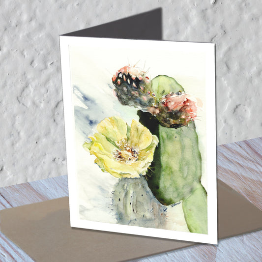 Prickly pear watercolor greeting card standing on a kraft envelope.