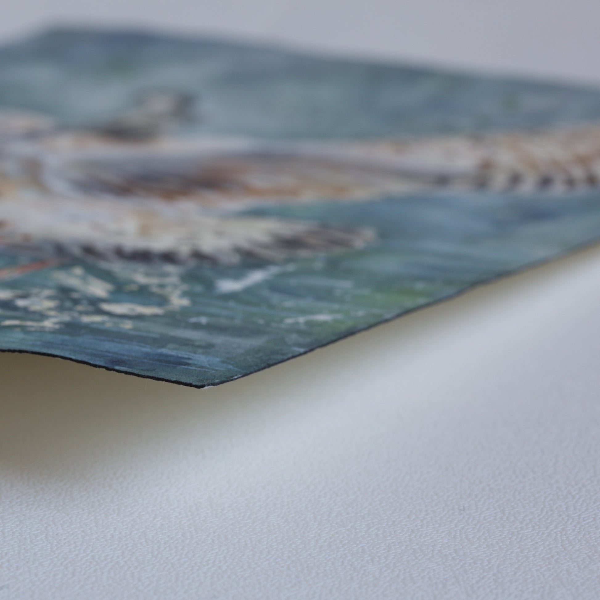 Corner detail of the original watercolor painting Wingspan Airlines by Silvana Varriale of VARsee Art, slightly lifted from a flat surface, showing the thickness and texture of professional Arches 100% cotton watercolor paper with its characteristic black edge binding.